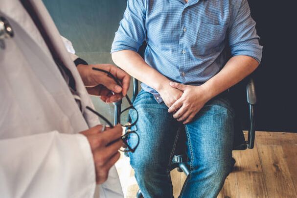 a man with symptoms of prostatitis during a visit to the doctor